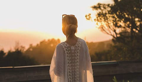 A woman viewing the sunset